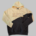 Two-tone beige and black hoodie with 'ALPHA' text trimmed in gold.