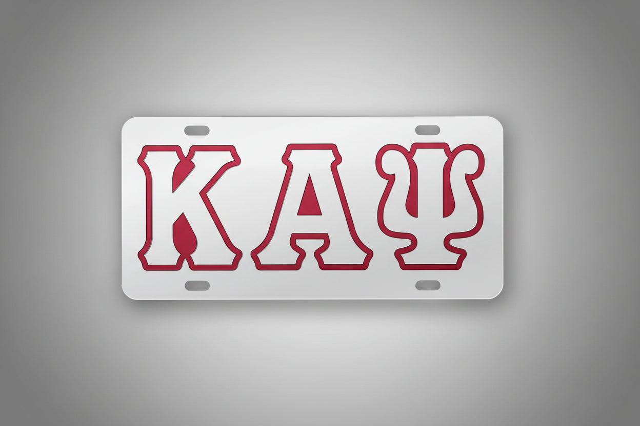 License plate with red letters 'KAP' on a gray background