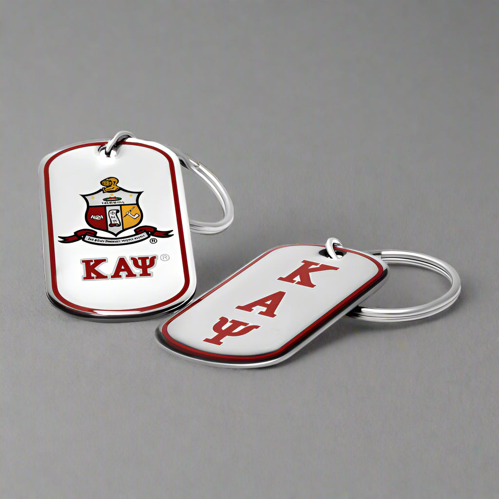 Two Kappa Alpha Psi keychains on a white background