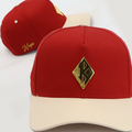 Red and cream cap with a gold kappa logo 