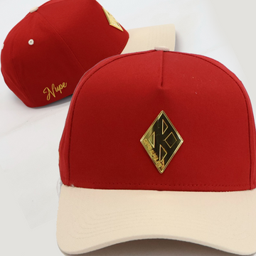 Red and cream cap with a gold kappa logo 
