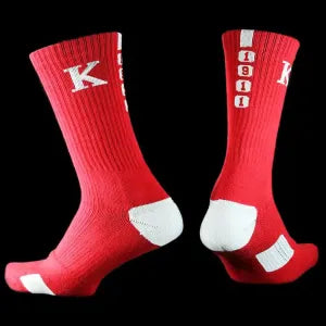Two red socks with a white 'K' logo on a white background