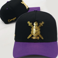 Black and purple cap with gold colored metal omega psi phi shield