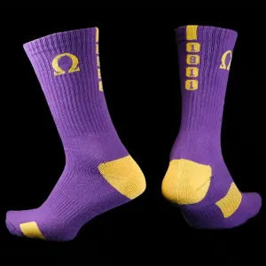 Purple socks with yellow accents on a black background