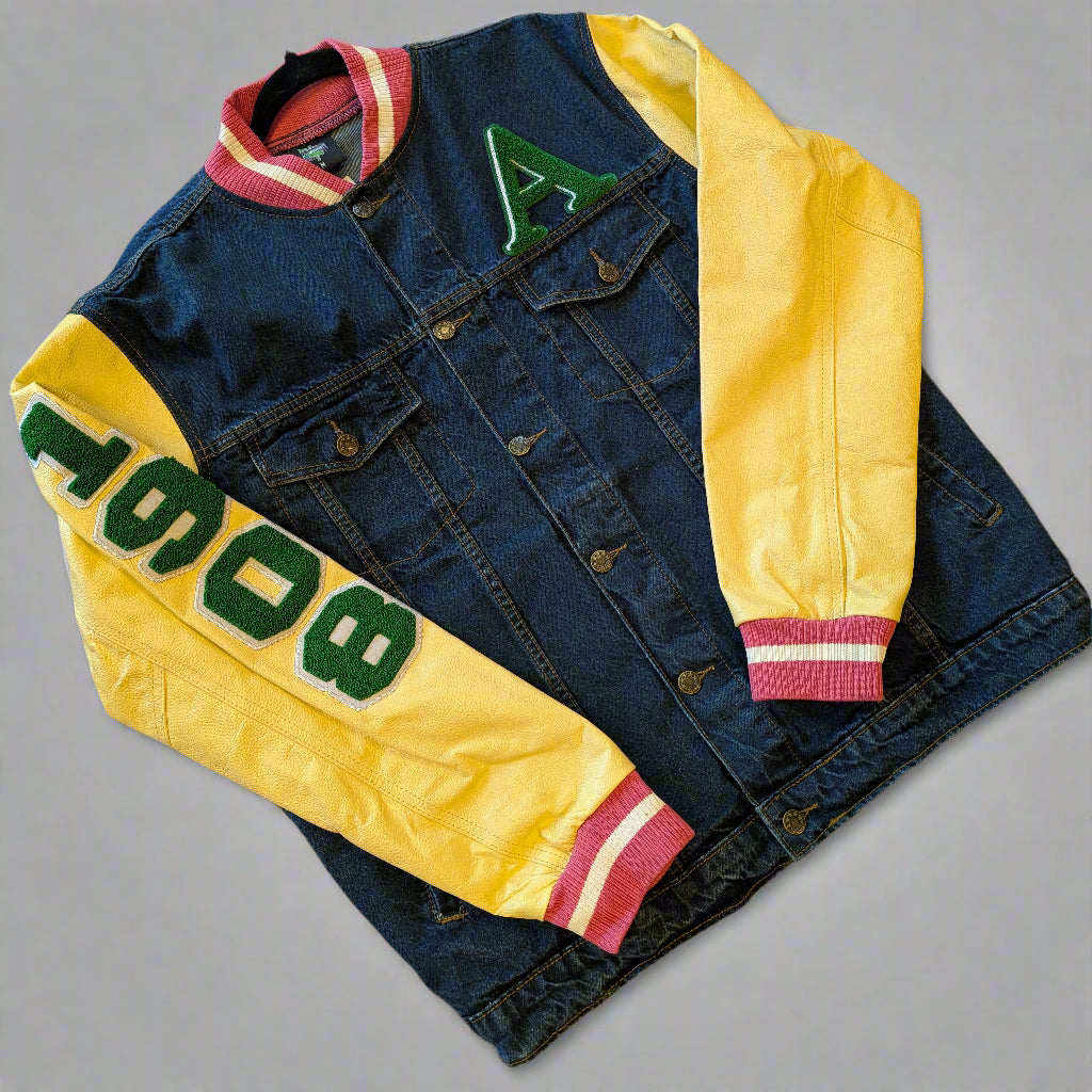 denim jacket with lettering on a wooden surface