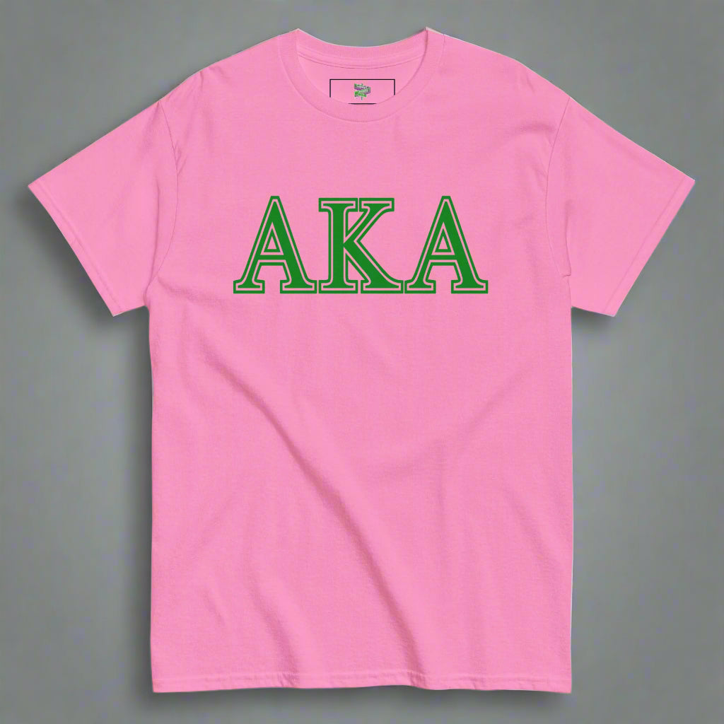 Pink t-shirt with 'AKA' in green letters on a gray background