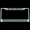 AKA license plate frame with green and pink text on a black background