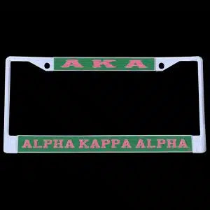 AKA license plate frame with green and pink text on a black background