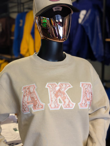 cream and pink crewneck