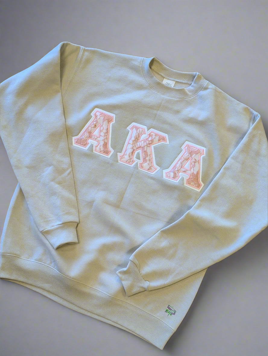 cream and pink crewneck