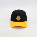 Black and yellow cap with a gold sphinx