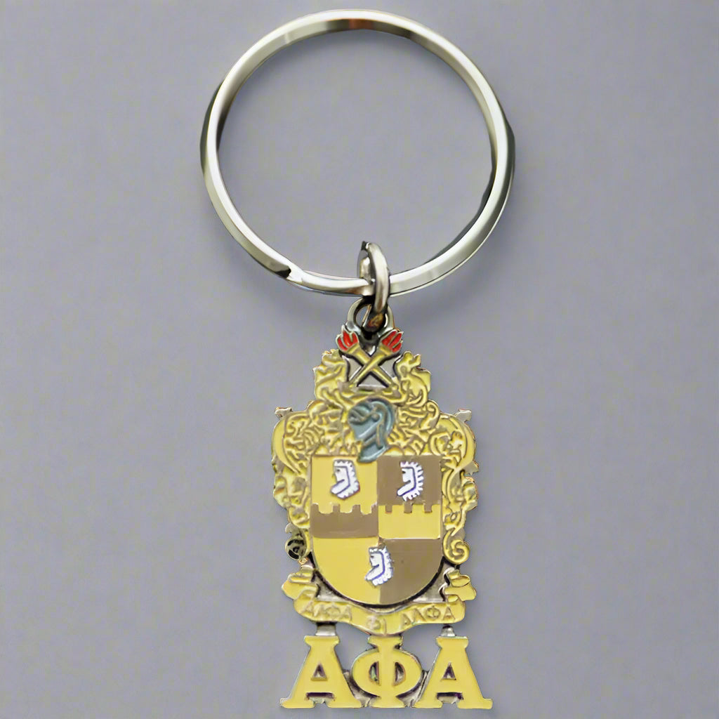 Keychain with a gold emblem and 'ΑΦΑ' letters on a black background