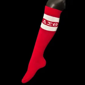 Red knee-high sock with a white band featuring a symbol on a black background