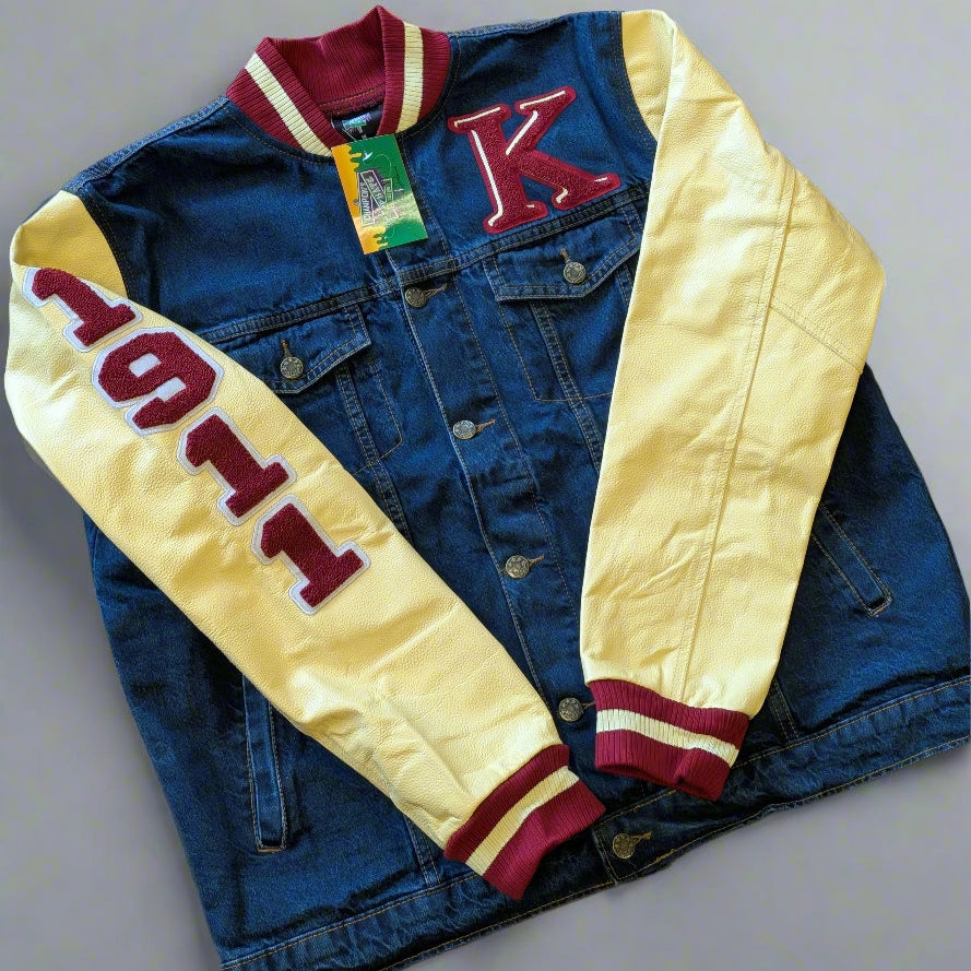 Denim jacket with cream sleeves and red lettering on a gray background