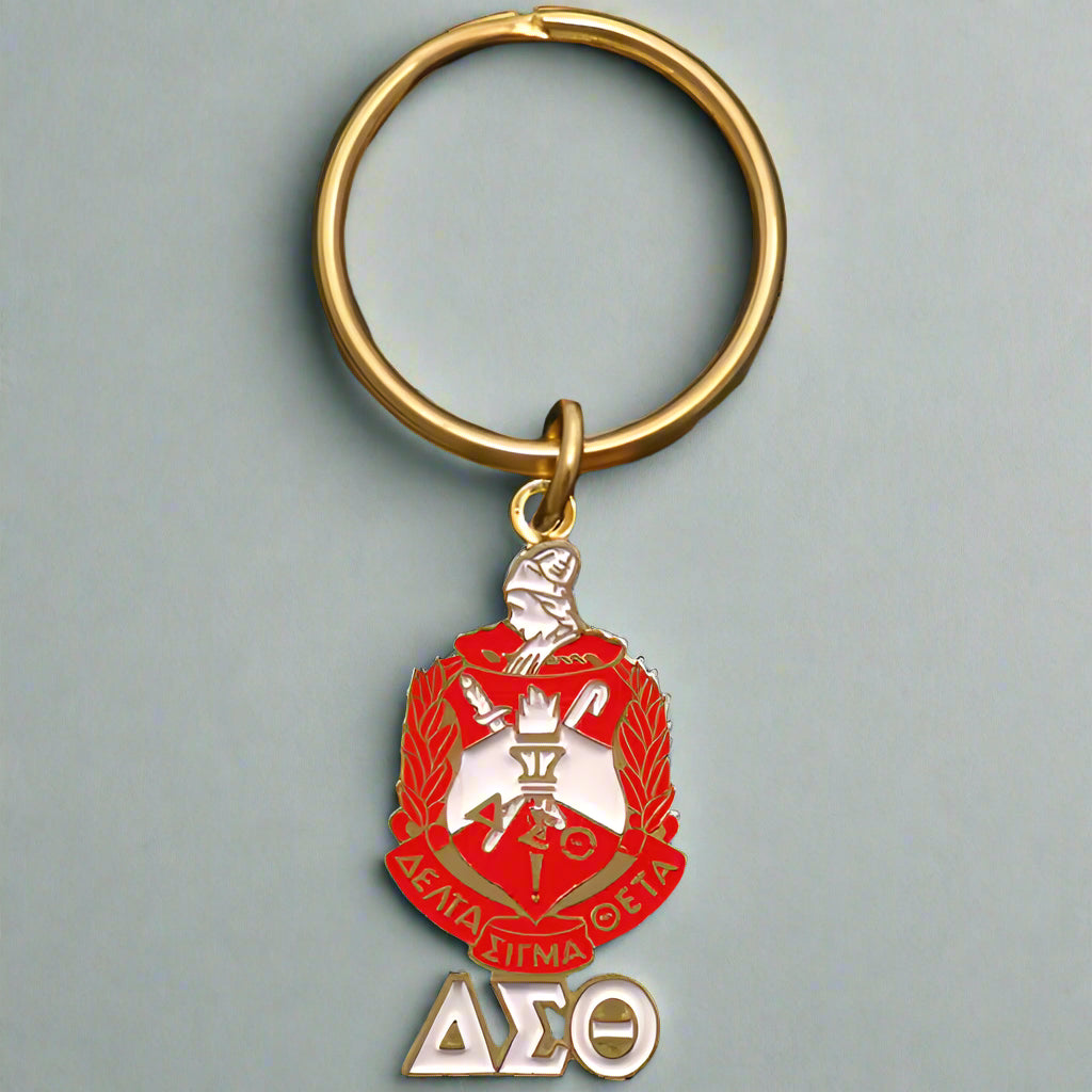 Keychain with a red and gold emblem and 'ΔΣΘ' letters on a black background