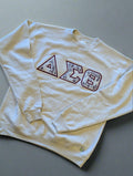 cream sweatshirt with Greek letter design 