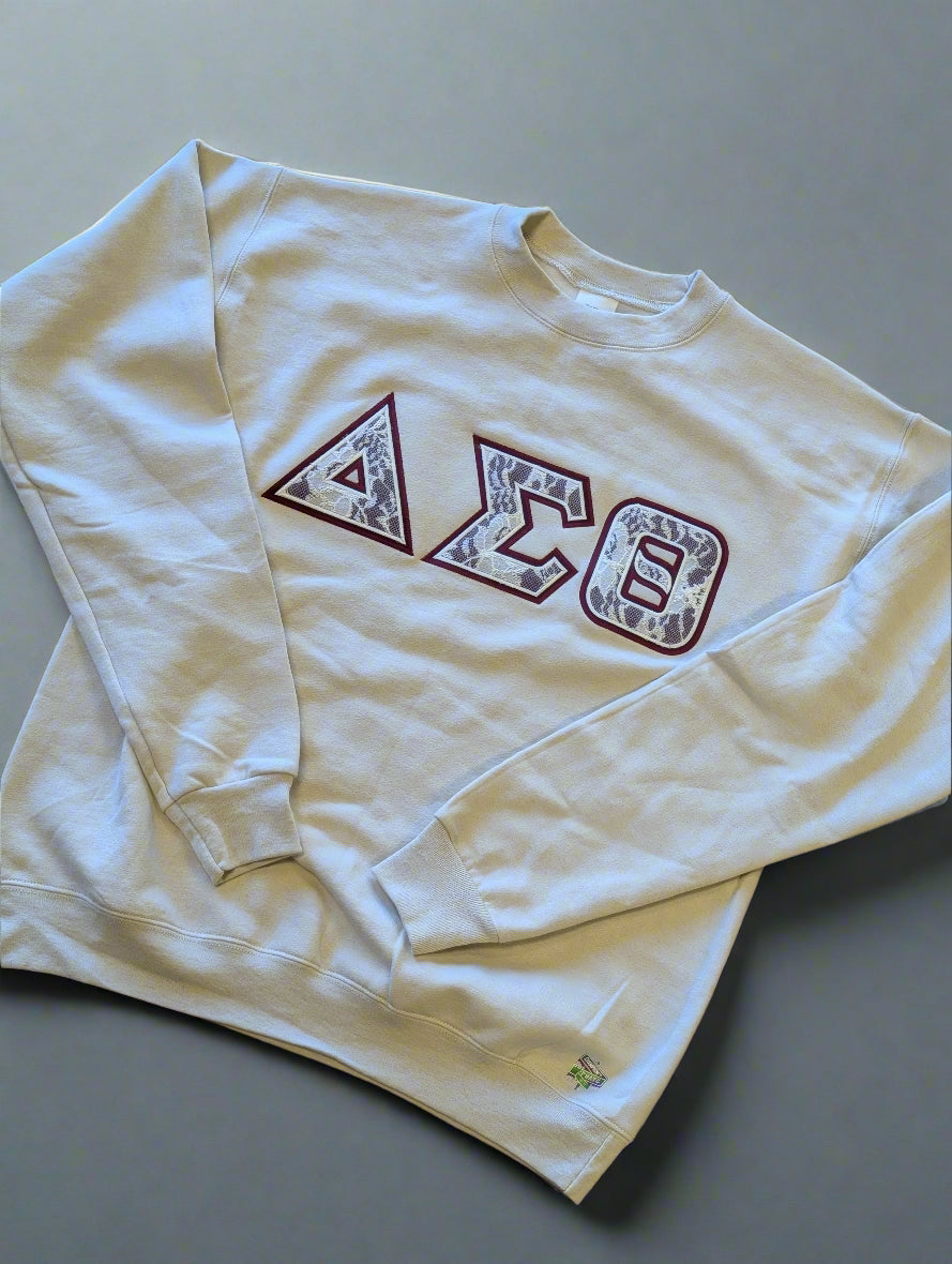 cream sweatshirt with Greek letter design 