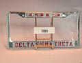 Delta Sigma Theta license plate frame with clear plastic wrapping