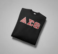 Black sweatshirt with red and white lettering on a gray background