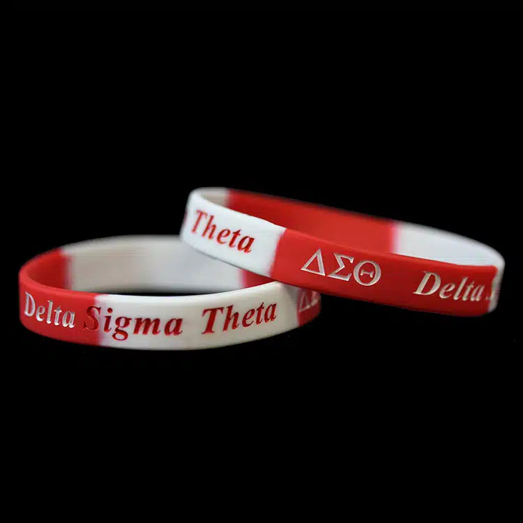Two red and white wristbands with 'Delta Sigma Theta' text on a black background