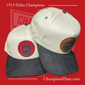 Two A-frame caps with suede brims, one main color is white and the other is black, featuring a red and a blue patch with crests, and a dark pin attached to each.