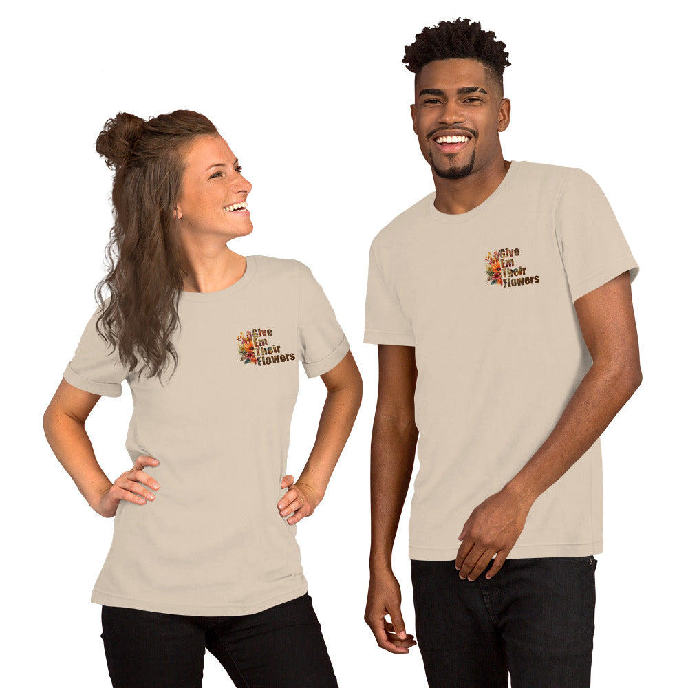 Two people wearing matching beige t-shirts with a design on a white background