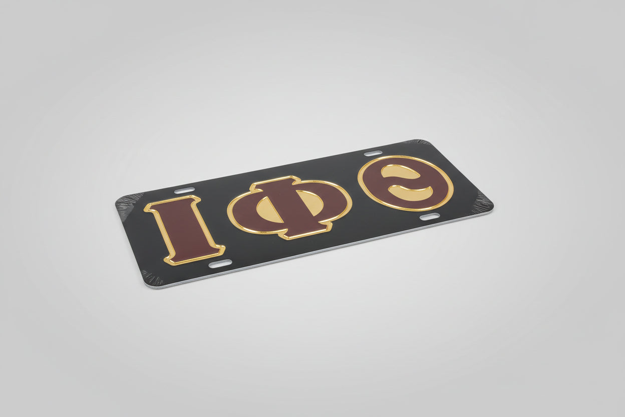 Black mirror license plate for Iota Phi Theta with brown and gold greek letters 