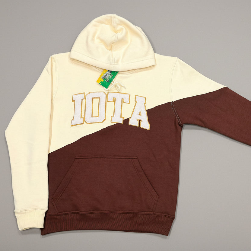 brown and cream hoodie with word "iota" on chest