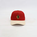 Red and cream cap with a gold plated kappa emblem