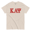 cream colored shirt with greek letters 