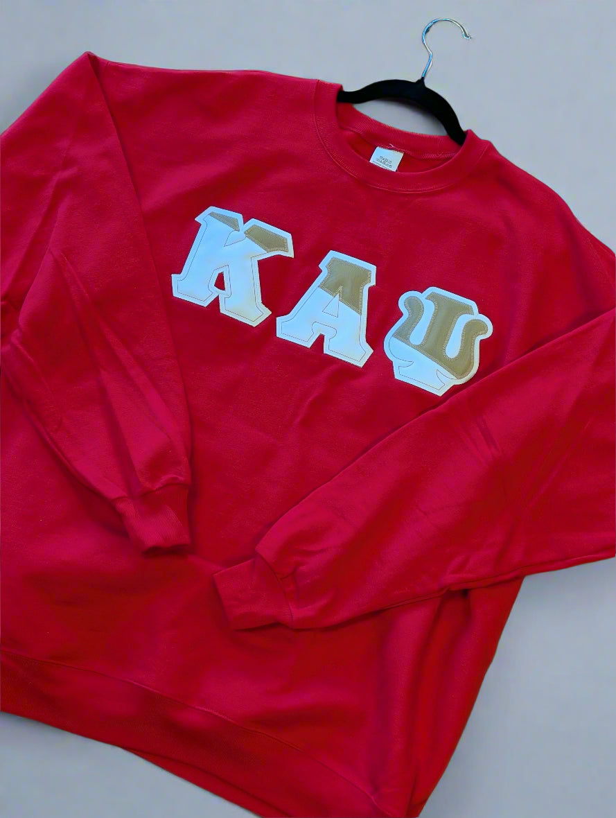 cream sweatshirt with red text on a plain background