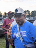 man wearing blue shirt with a phi beta sigma smoker hat