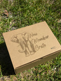 Cardboard box with 'New Member Crate' and elephant illustration on grass