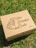 Cardboard box with 'New Member Crate' and bulldog