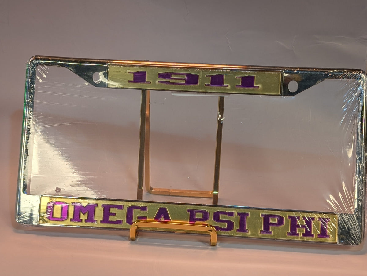License plate frame with 'Omega Psi Phi' and '1911' text on a clear background