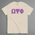 Beige t-shirt with purple Omega Psi Phi letters on a white background
