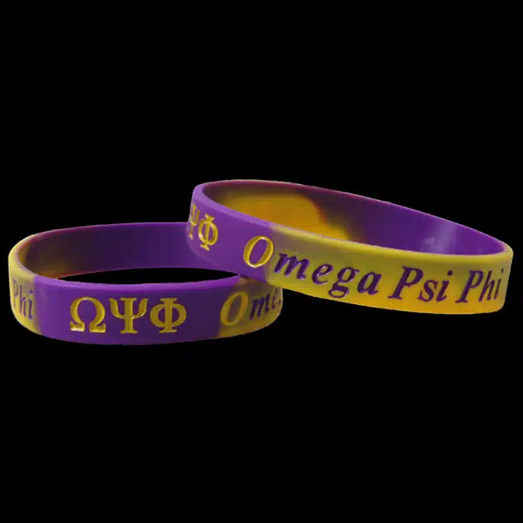 Two purple and yellow Omega Psi Phi bracelets on a black background