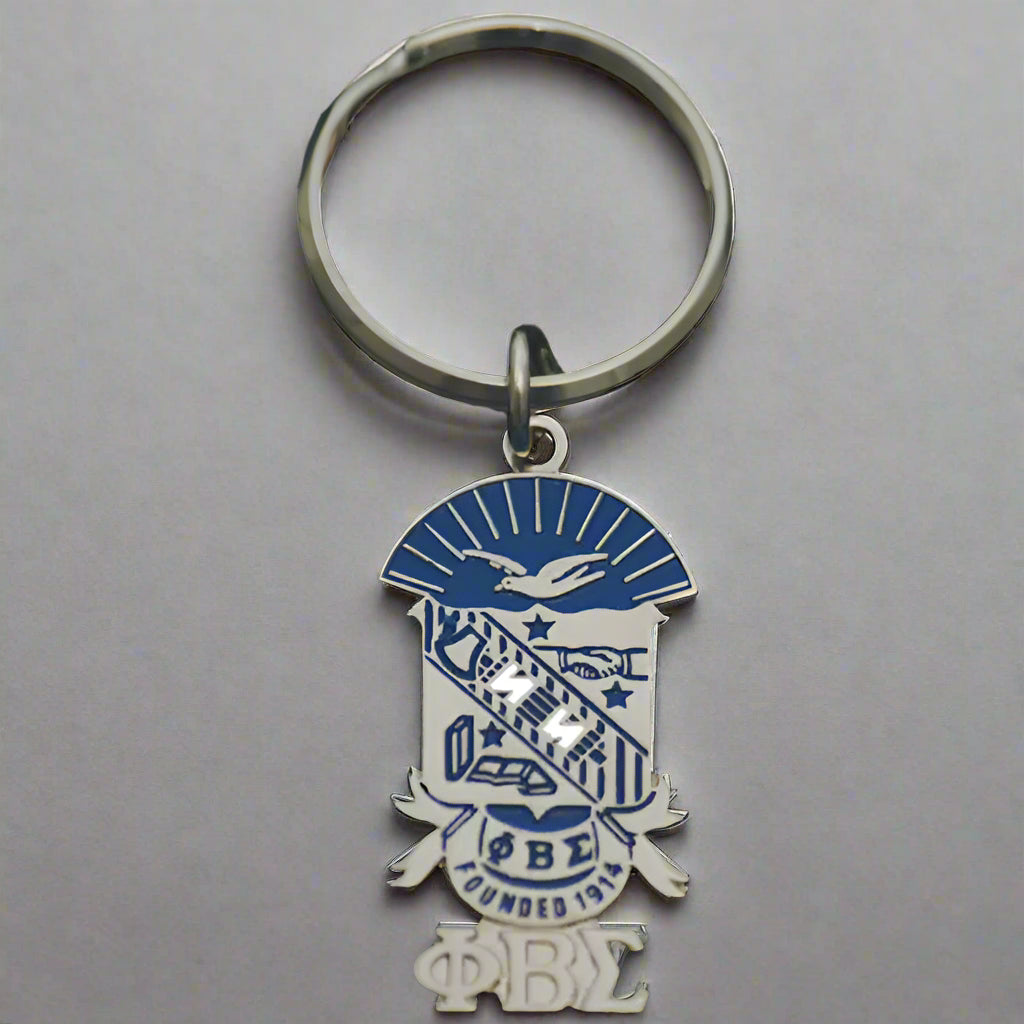 Keychain with a blue and silver emblem on a black background