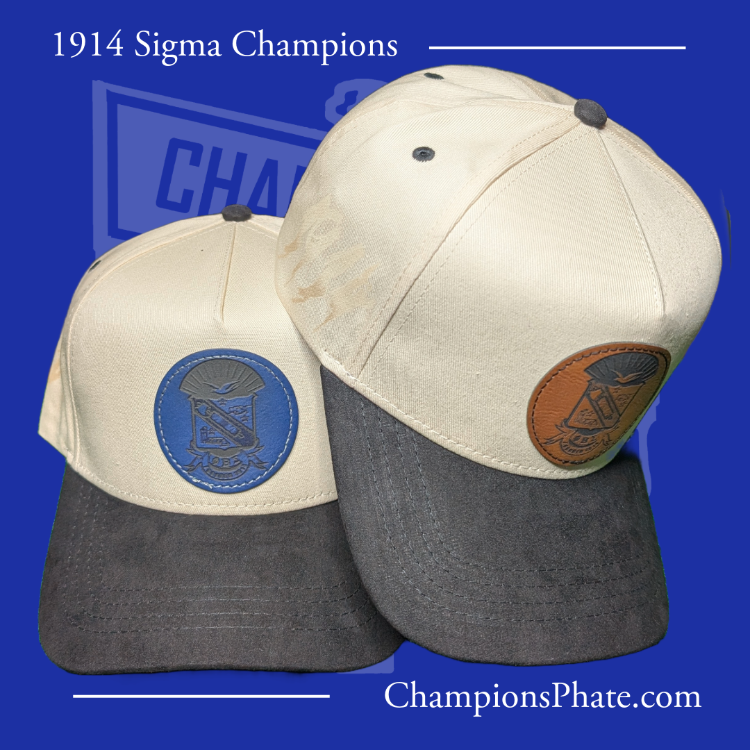 Two baseball caps with embroidered logos on a blue background, featuring the text '1914 Sigma Champions' and 'ChampionsPhate.com'.