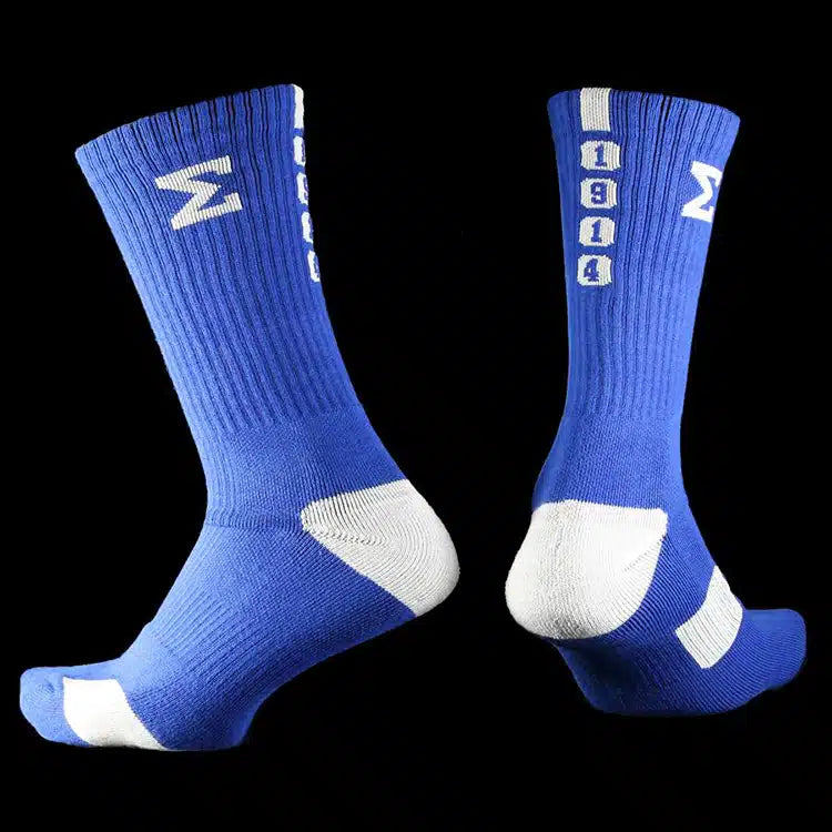 Pair of blue socks with white bold greek letter for sigma and the year 1914 white accents on a black background