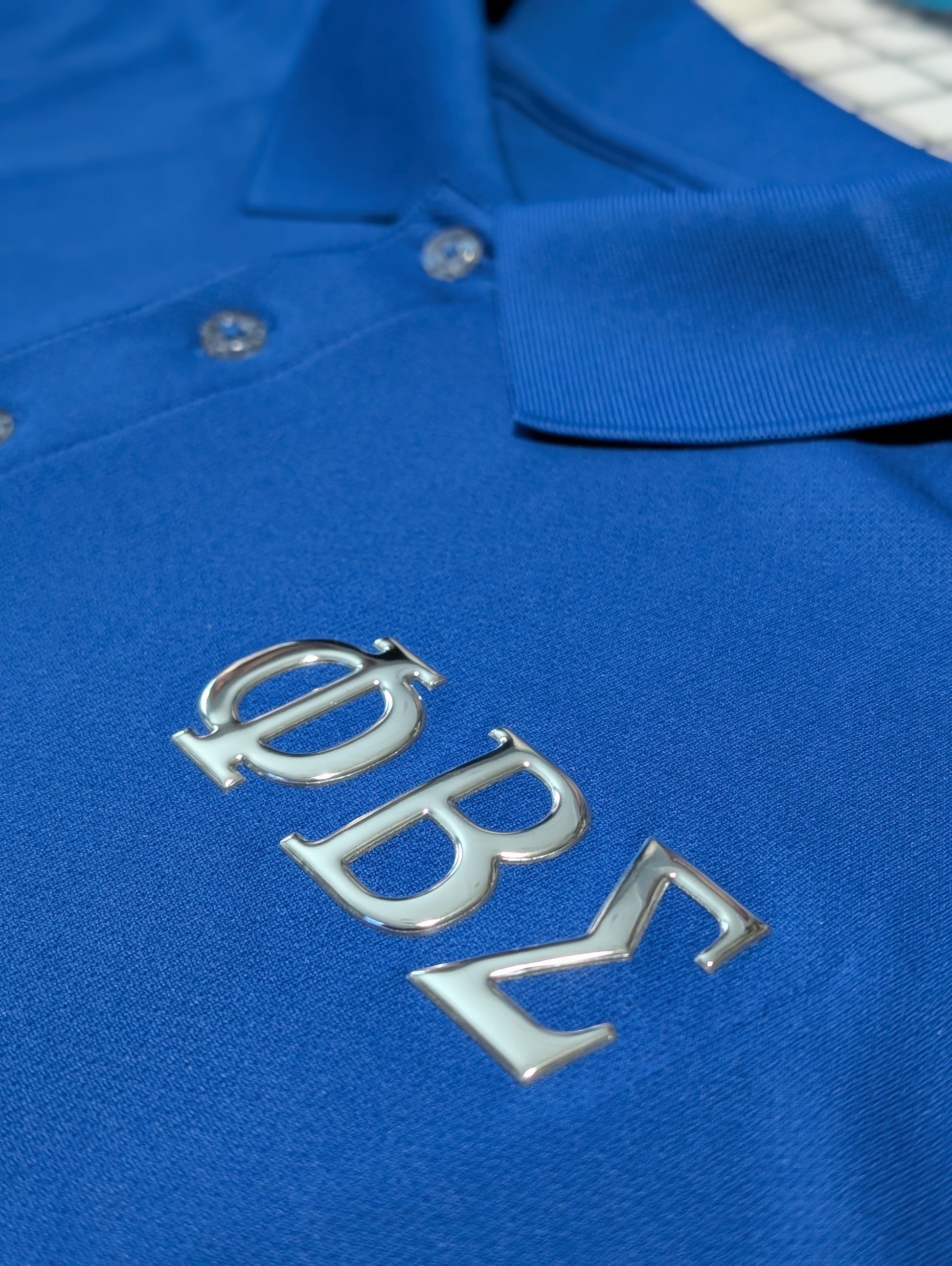 blue polo with silver metallic greek letters phi beta sigma