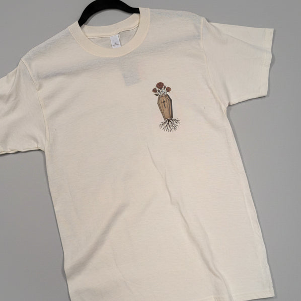 Beige t-shirt with a casket with rose growing from top and roots growing from bottom