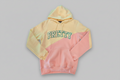 two tone Color-blocked hoodie with 'PRETTY' text on a cream and pink hoodie