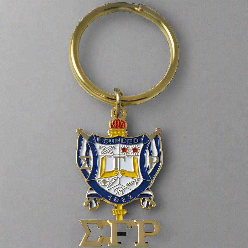 Keychain with a crest and letters 'ΣΓΡ' on a black background
