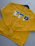 Yellow sweatshirt with text on a gray background