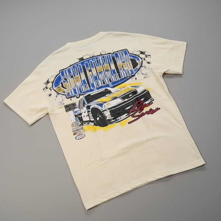 cream tee with a racing car design and words "sigma gamma rho"