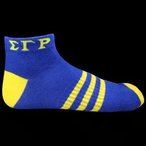 Blue and yellow socks with 'ΣΓΡ' lettering on a black background