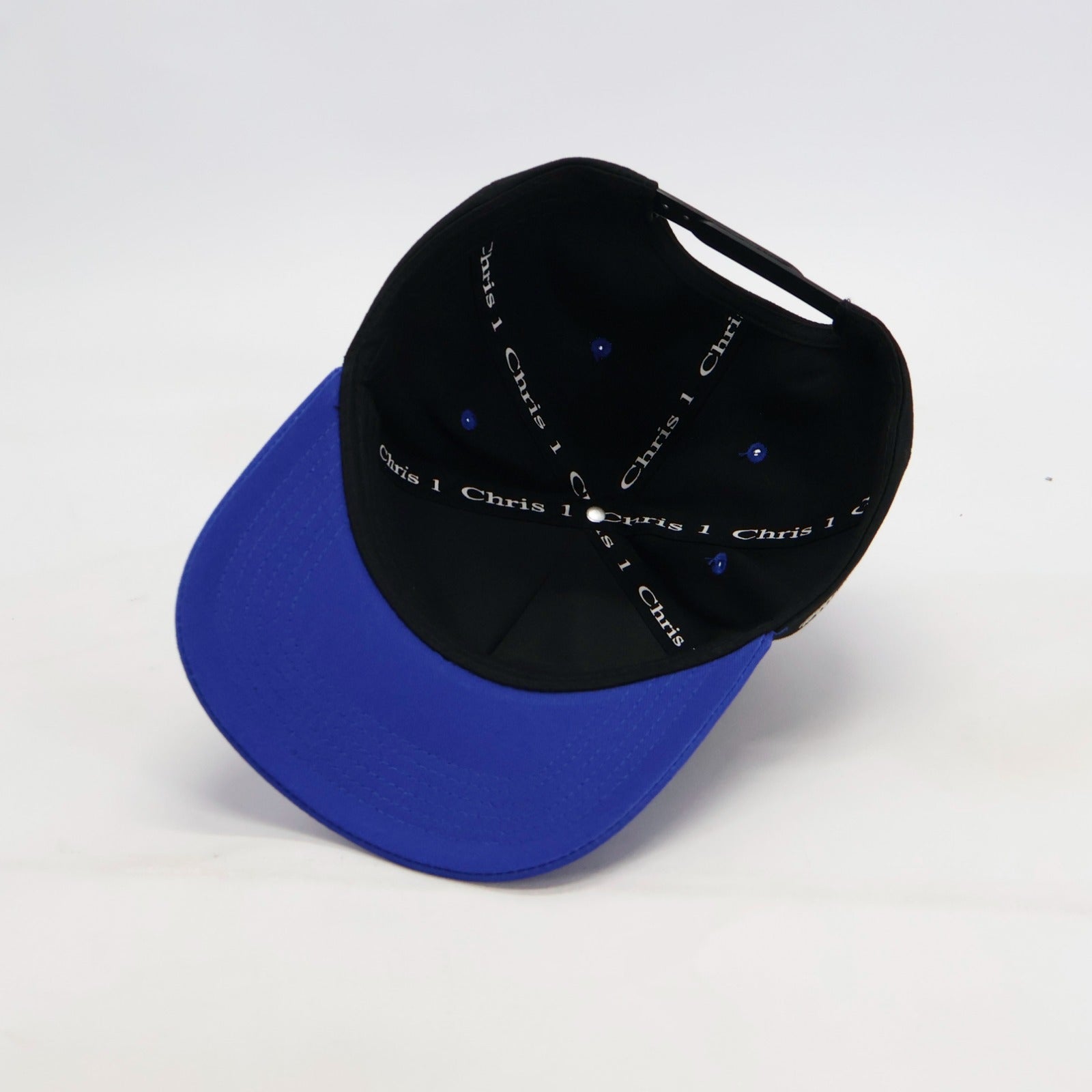 Black and blue cap with text on a white background