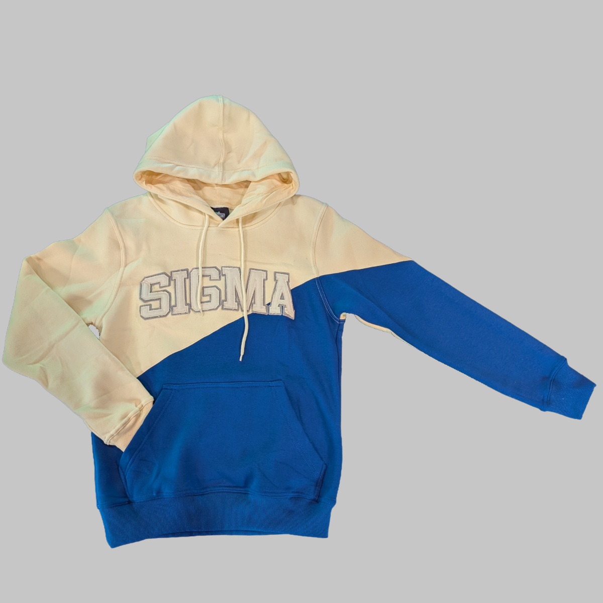 Two-tone beige and blue hoodie with 'SIGMA' text on a gray background