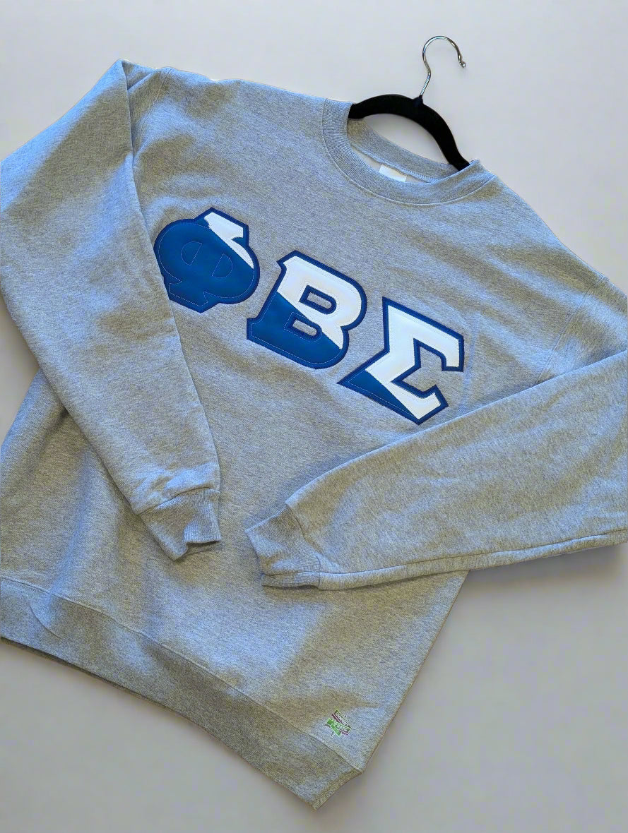 Blue sweatshirt with white lettering on a gray background